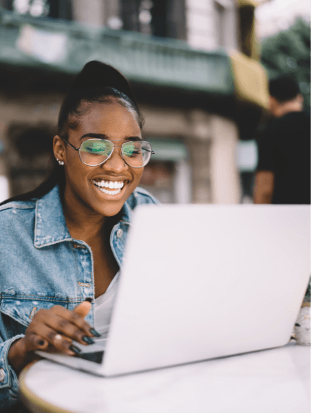 Person Outside Using Total VPN on Laptop