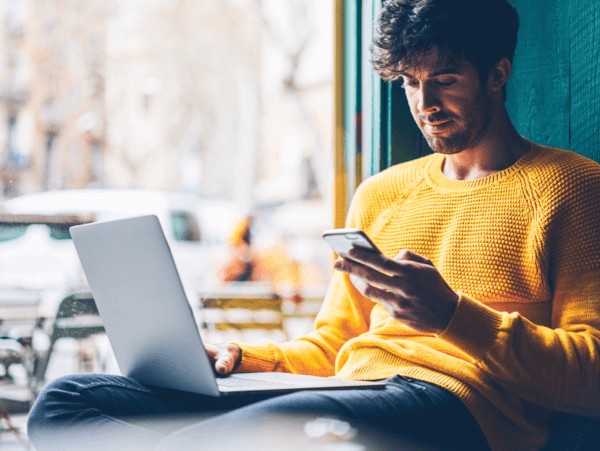 Person Using Total VPN on Laptop